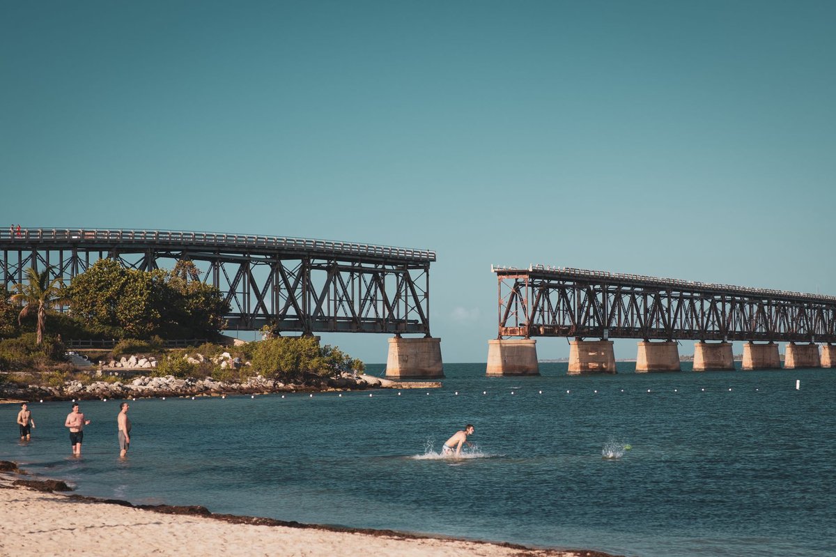 Sandy beach and the old railroad bridge at Bahia Honda State Park in the Florida Keys