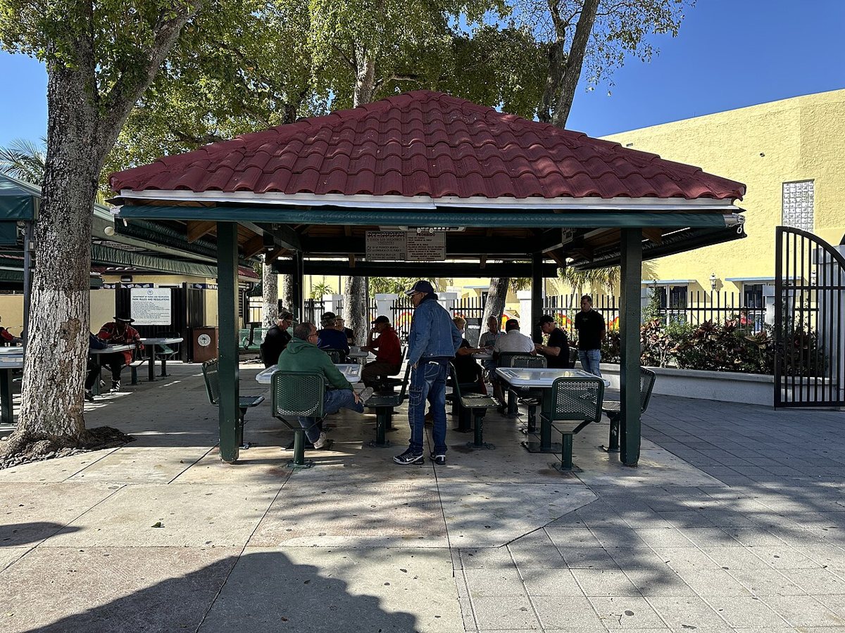 Older men playing dominoes at Domino Park on Calle Ocho in Little Havana