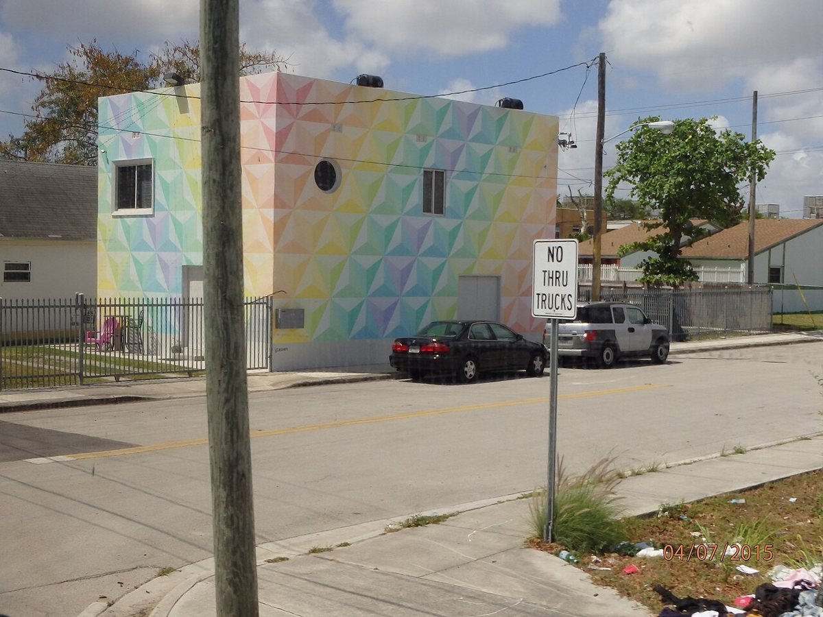 Free outdoor mural on a warehouse wall in Wynwood Miami arts district